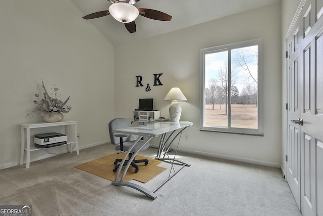 carpeted office featuring vaulted ceiling, baseboards, and ceiling fan