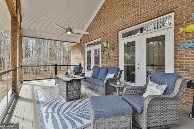 wooden terrace with ceiling fan, an outdoor hangout area, and french doors