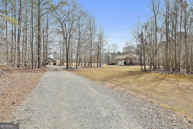 view of road with driveway