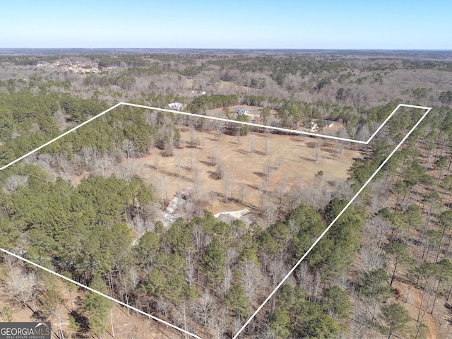 bird's eye view with a rural view and a view of trees