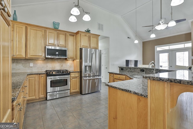 kitchen featuring visible vents, appliances with stainless steel finishes, tile patterned floors, french doors, and a sink