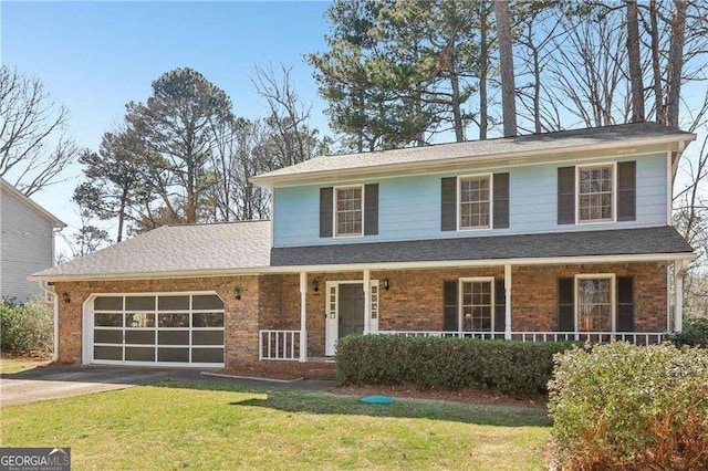 view of front facade featuring driveway, a garage, a front yard, a porch, and brick siding