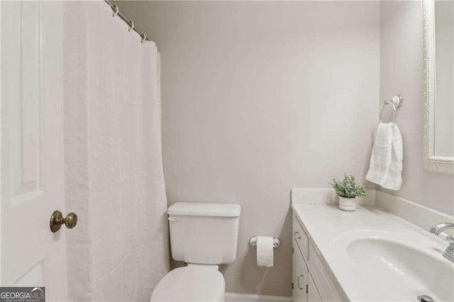 bathroom with vanity and toilet