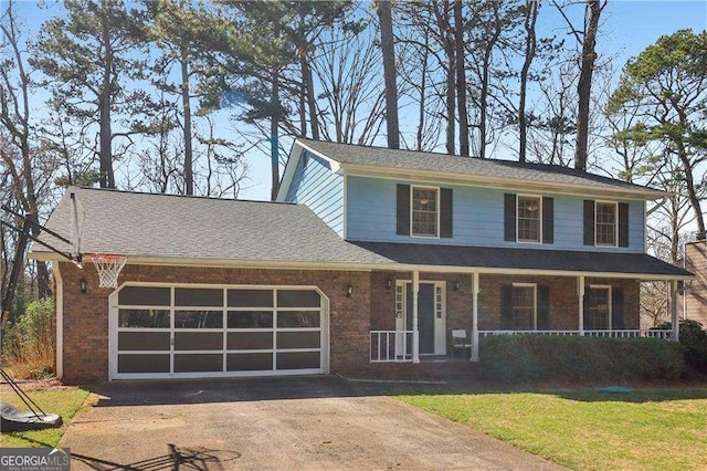 view of front of home with a garage, brick siding, aphalt driveway, covered porch, and a front yard