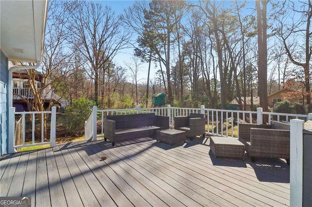 wooden deck featuring an outdoor hangout area