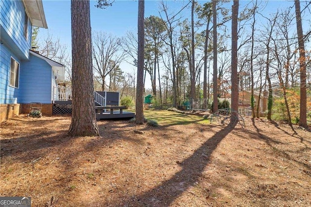 view of yard featuring a deck