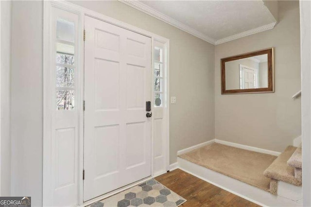 entryway featuring baseboards, dark wood-style flooring, and crown molding