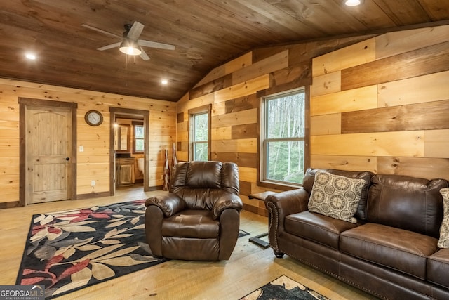 living area featuring wood ceiling, wood finished floors, vaulted ceiling, wood walls, and recessed lighting