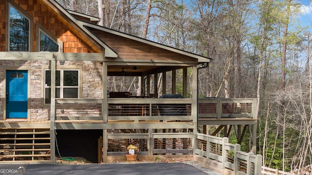 view of property exterior with stone siding