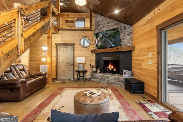 living room featuring wood ceiling, wood walls, and hardwood / wood-style floors