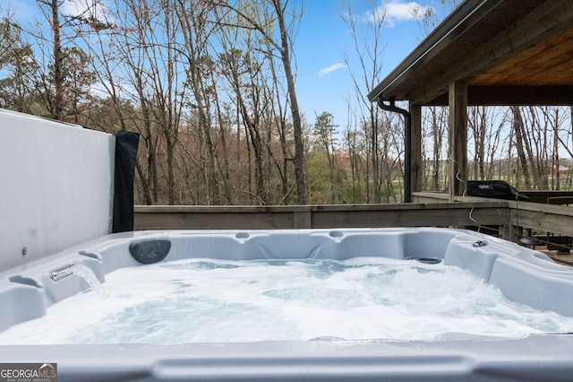 deck with a hot tub