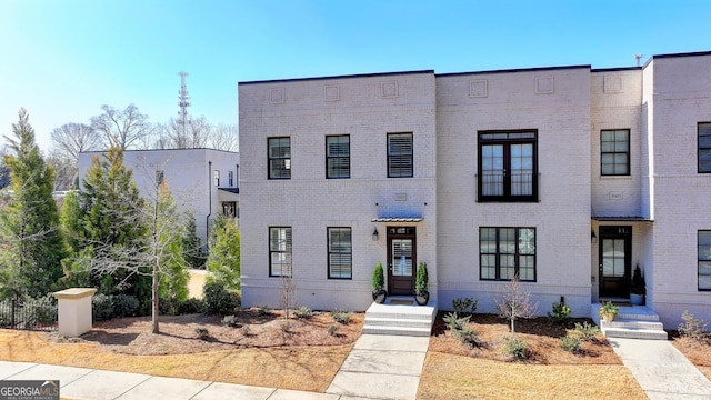 view of front of home with brick siding