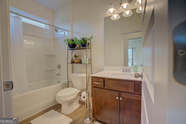 full bathroom featuring toilet, shower / tub combo, wood finished floors, and vanity