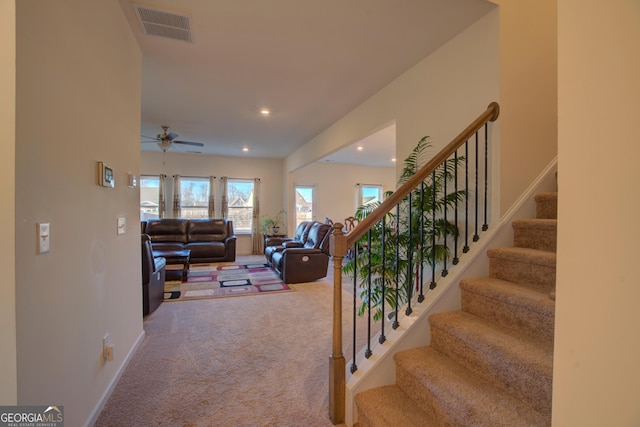 carpeted living room with stairs, recessed lighting, visible vents, and baseboards