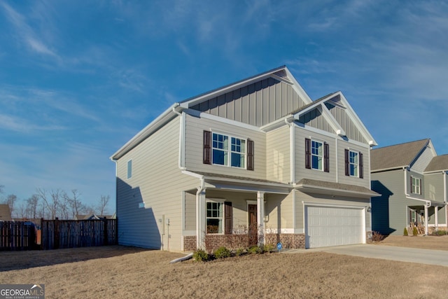 craftsman-style house with a garage, concrete driveway, fence, board and batten siding, and brick siding