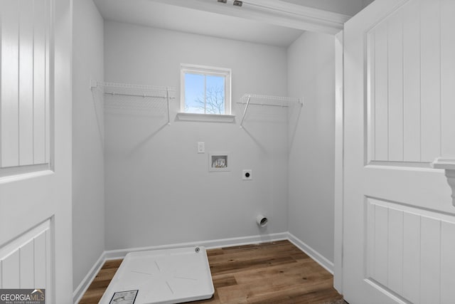 laundry room with dark wood-style flooring, hookup for a washing machine, electric dryer hookup, laundry area, and baseboards