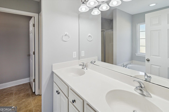 bathroom featuring tile patterned floors, a sink, and a shower stall