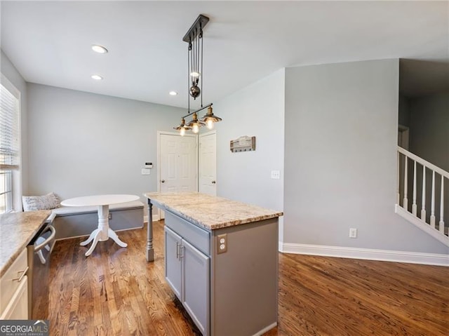 kitchen featuring recessed lighting, gray cabinets, dark wood-style flooring, and decorative light fixtures