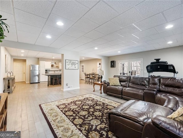 living area featuring recessed lighting and light wood finished floors