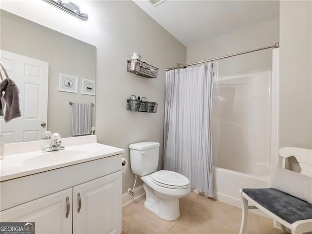 bathroom with baseboards, toilet, tile patterned floors, shower / bath combo with shower curtain, and vanity