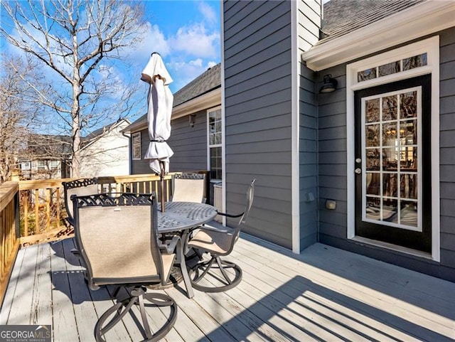 wooden deck with outdoor dining area