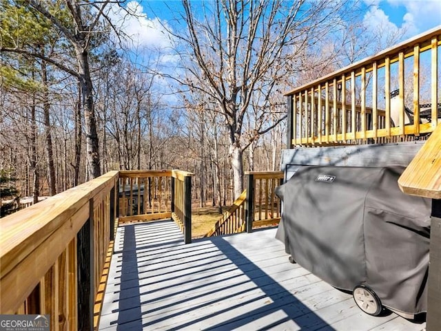 wooden deck with area for grilling