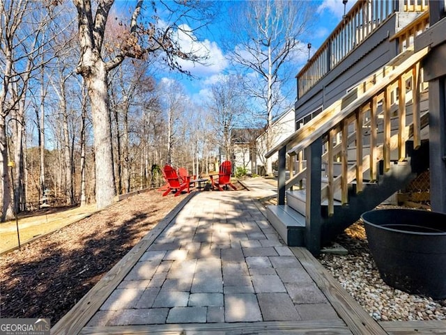 exterior space featuring a patio and stairway