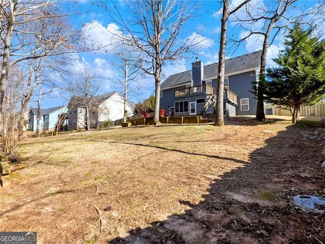 view of yard with a wooden deck