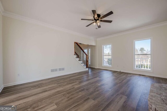 3800 George Williams Rd, Monroe, GA 30656 - empty room with dark wood finished floors, visible vents, ornamental molding, baseboards, and stairs