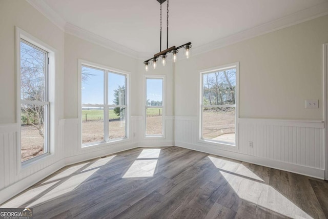 3800 George Williams Rd, Monroe, GA 30656 - unfurnished dining area featuring plenty of natural light, crown molding, dark wood-type flooring, and wainscoting