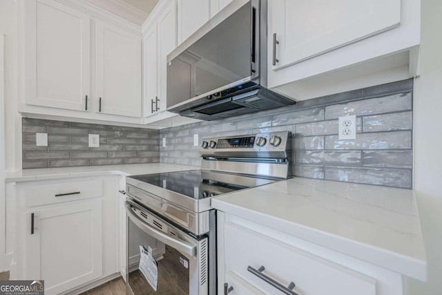 3800 George Williams Rd, Monroe, GA 30656 - kitchen featuring light stone countertops, tasteful backsplash, white cabinetry, and stainless steel appliances
