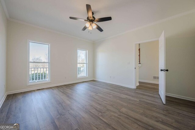 3800 George Williams Rd, Monroe, GA 30656 - empty room with ornamental molding, dark wood-style flooring, visible vents, and baseboards