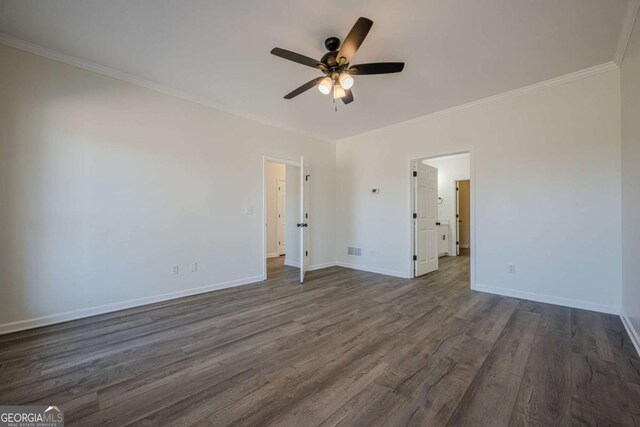 3800 George Williams Rd, Monroe, GA 30656 - unfurnished bedroom with ceiling fan, baseboards, dark wood finished floors, and crown molding