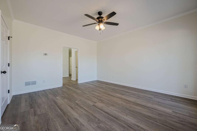 3800 George Williams Rd, Monroe, GA 30656 - spare room with a ceiling fan, baseboards, visible vents, dark wood finished floors, and crown molding