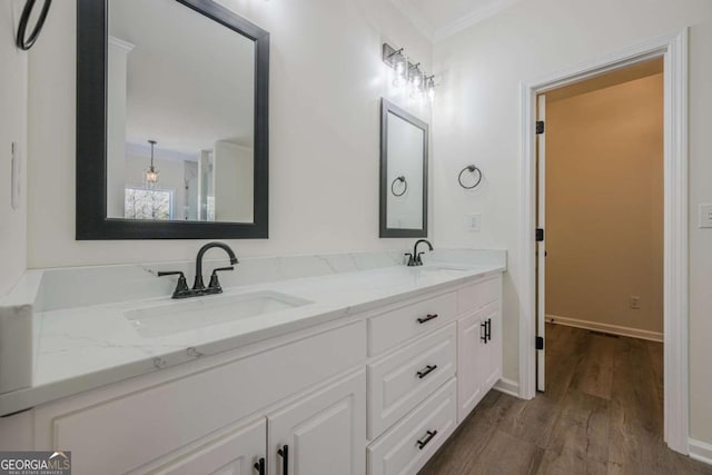 3800 George Williams Rd, Monroe, GA 30656 - full bathroom featuring double vanity, crown molding, and wood finished floors