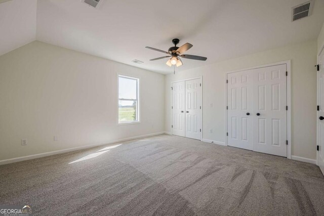 3800 George Williams Rd, Monroe, GA 30656 - unfurnished bedroom featuring baseboards, carpet floors, visible vents, and multiple closets