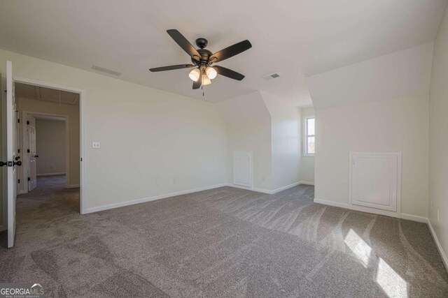 3800 George Williams Rd, Monroe, GA 30656 - spare room featuring carpet floors, lofted ceiling, visible vents, and baseboards