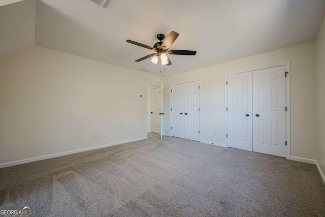 3800 George Williams Rd, Monroe, GA 30656 - unfurnished bedroom with carpet flooring, two closets, and ceiling fan