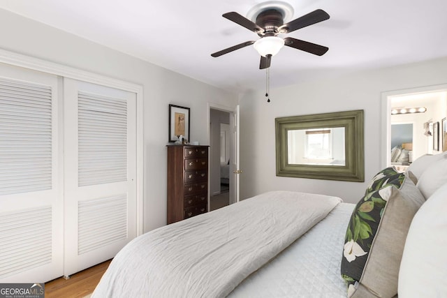 bedroom featuring a closet, wood finished floors, and a ceiling fan