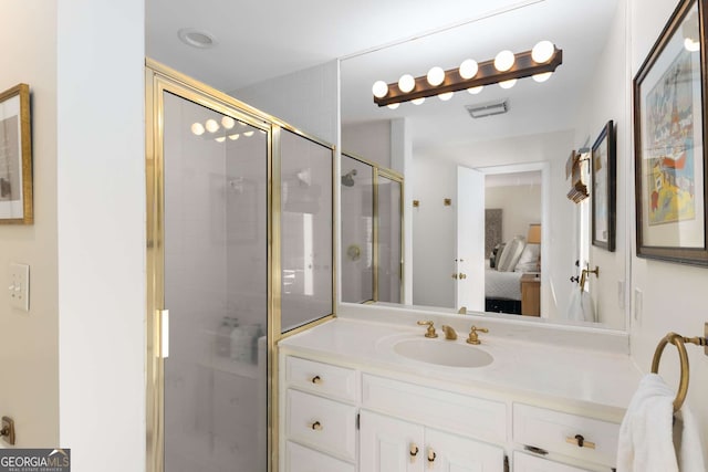 ensuite bathroom with a stall shower, visible vents, vanity, and ensuite bath