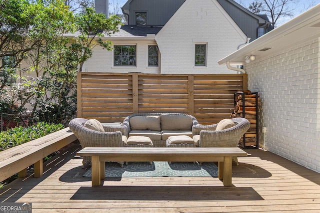 wooden terrace with outdoor lounge area