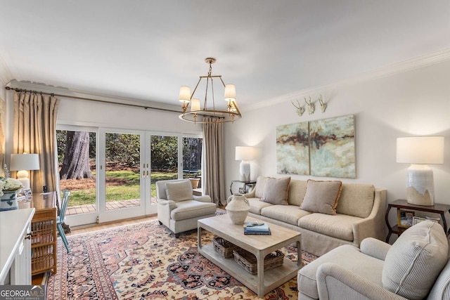 living area featuring a chandelier, french doors, crown molding, and wood finished floors