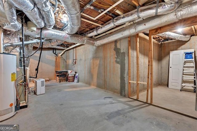 unfinished basement with gas water heater