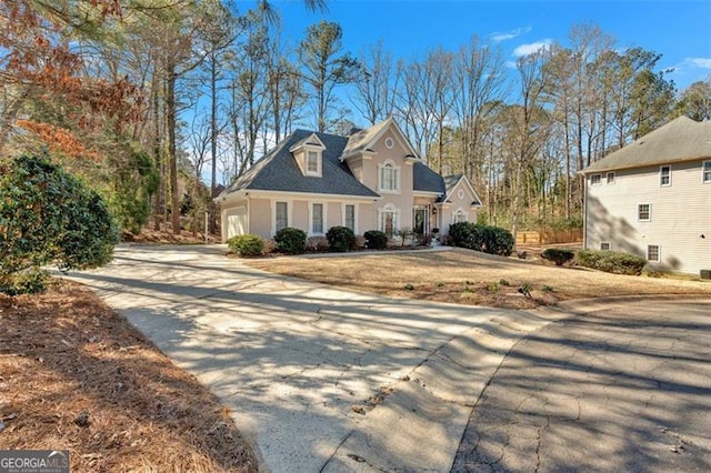 view of front of home with driveway and an attached garage