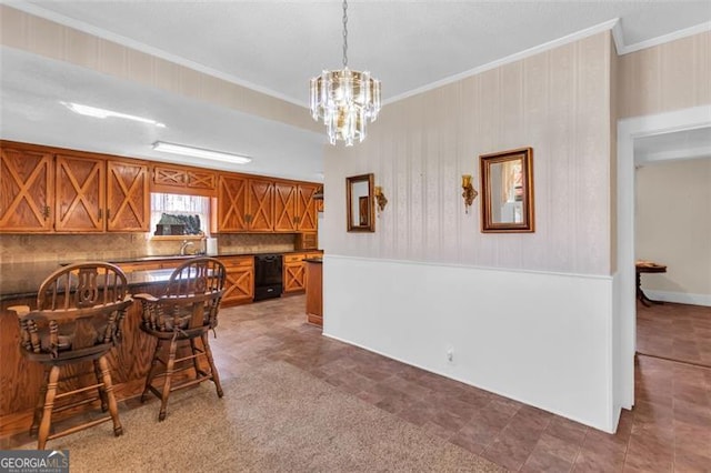 kitchen with pendant lighting, brown cabinets, tasteful backsplash, dark countertops, and crown molding