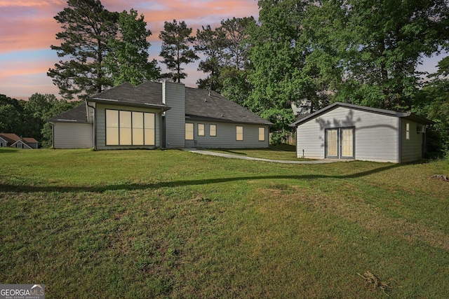 2768 Southpark Blvd SW, Conyers, GA 30094 - back of property with a lawn and an outdoor structure
