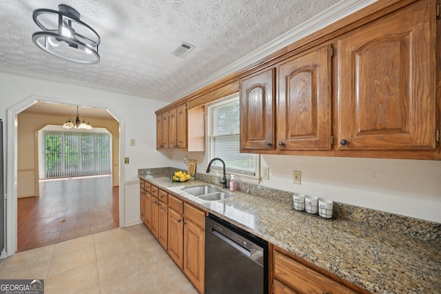 2768 Southpark Blvd SW, Conyers, GA 30094 - kitchen with dishwasher, a sink, a chandelier, brown cabinetry, and light stone counters