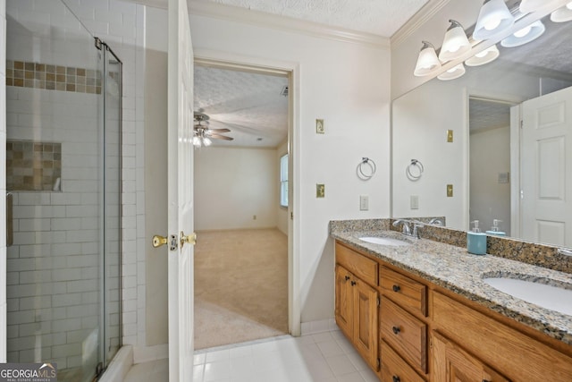 2768 Southpark Blvd SW, Conyers, GA 30094 - full bathroom featuring a textured ceiling, a stall shower, ceiling fan, double vanity, and tile patterned flooring