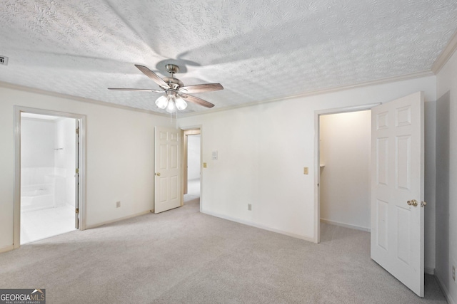 2768 Southpark Blvd SW, Conyers, GA 30094 - unfurnished bedroom featuring carpet, a textured ceiling, ensuite bath, baseboards, and a ceiling fan