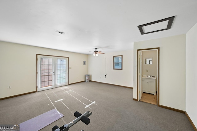 2768 Southpark Blvd SW, Conyers, GA 30094 - unfurnished living room featuring carpet floors, baseboards, and ceiling fan
